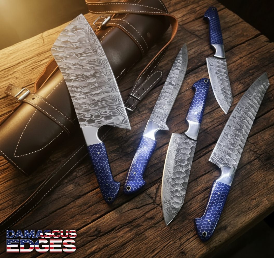 kitchen set Hand-forged Damascus steel kitchen knife set, 9–14 inch blades, with blue honeycomb handles and leather roll bag on rustic bladesmith workbench.